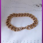 دستبند کارتیه فاصله دار طلایی استیل